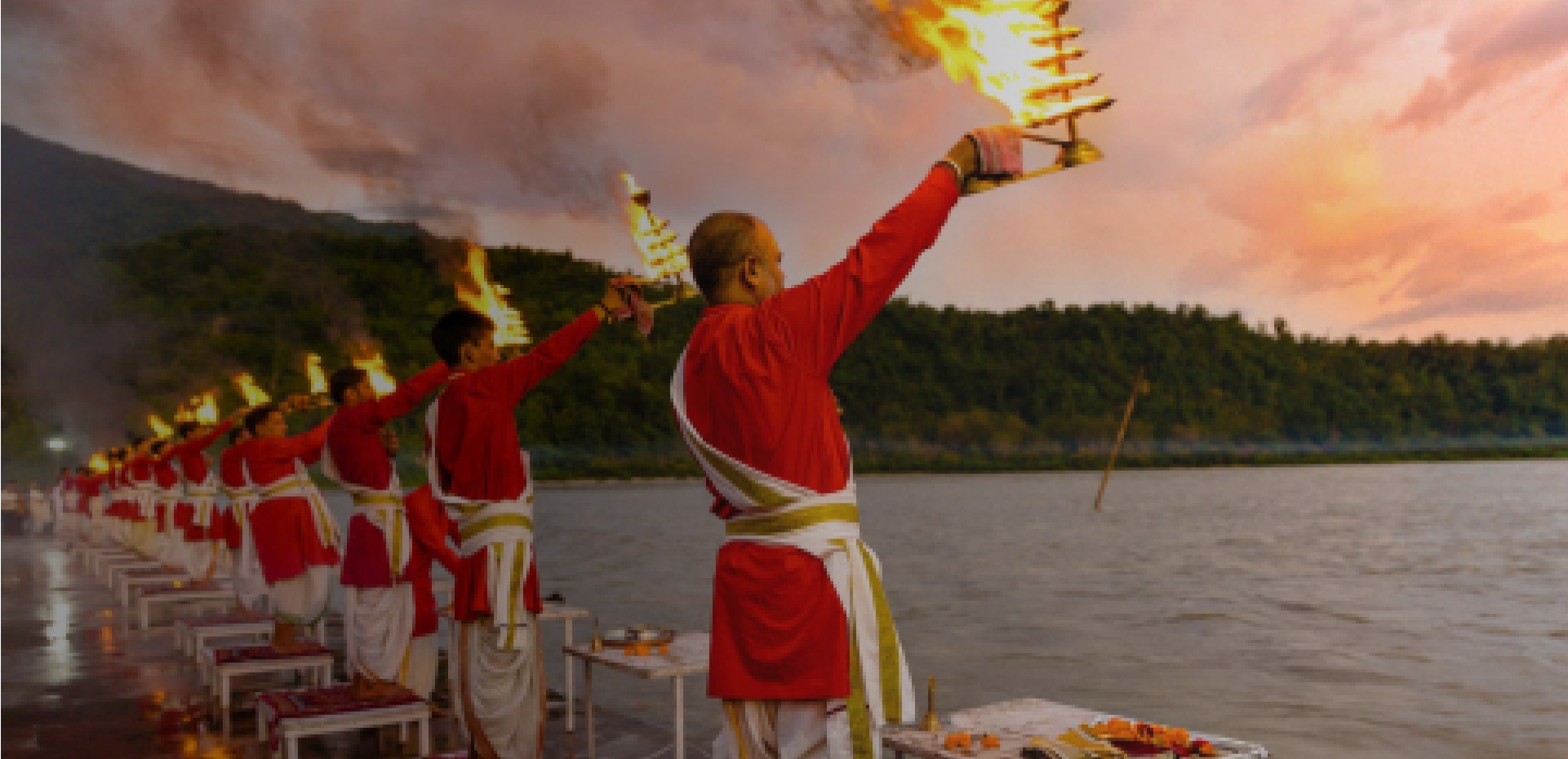 helicopter flying over mountains with temples